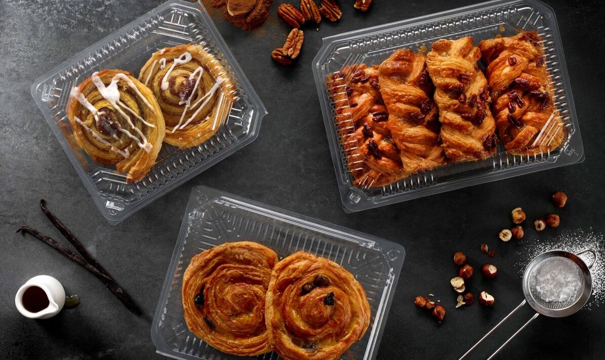 Clear PET hinged bakery containers for displaying and protecting fresh pastries in retail bakery, foodservice and takeaway environments.