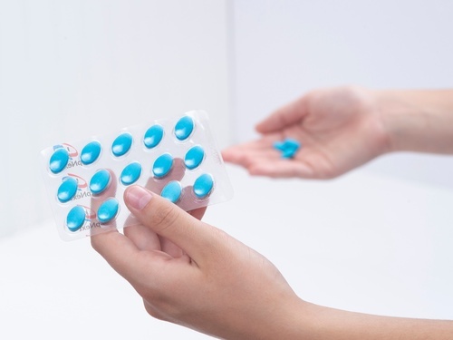 Woman hands holding a blister packaging 