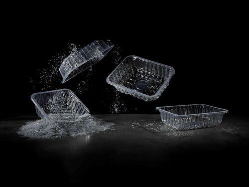 this pictures shows four recycable transparent food packaging trays 