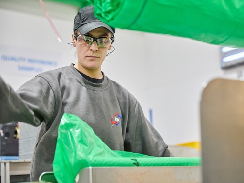 Picture showing a woman working in production