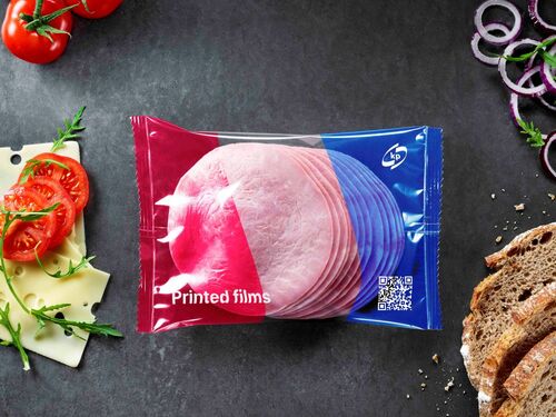 Picture showing a coloured flexible food film packaging with ham inside 