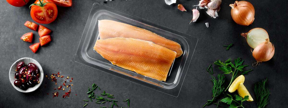 A food packaging PET rigid film with a salmon inside
