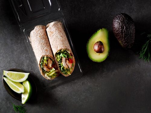 A transparent food packaging tray with to wraps inside