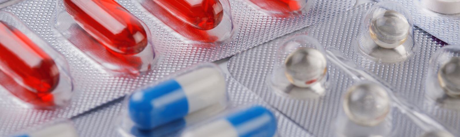 Picture shows Pharmaceutical Blister packaging with pills in several colours