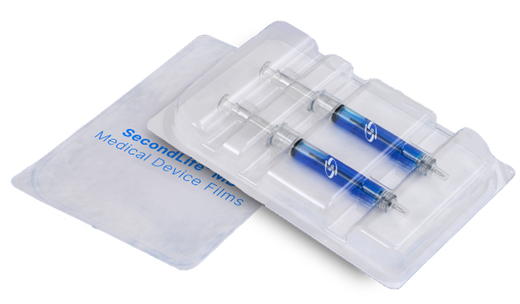 Medical device film packaging tray with pre-filled syringes in transparent thermoformed sterile packaging.