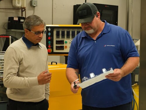 lastic packaging manufacturing experts inspecting thermoforming mould equipment and production tooling to ensure quality, efficiency and operational performance.