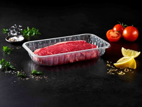 The picture showing a transparent protein food packaging tray with meat inside