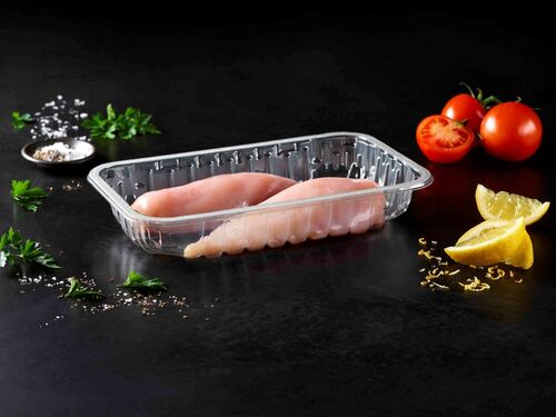 The picture showing a transparent protein food packaging tray with two chicken breasts inside