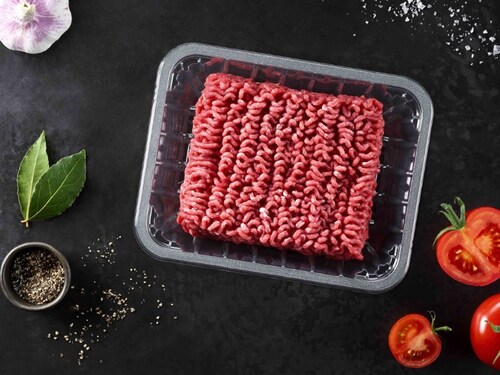 The picture showing a transparent protein food packaging tray with minced meat inside