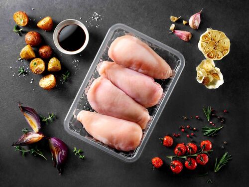 The picture showing a transparent protein food packaging tray with chicken inside