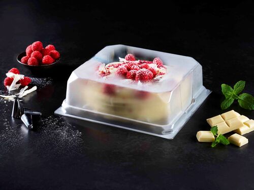 Picture showing a transparent plastic container based of rigid films with a cake in it 