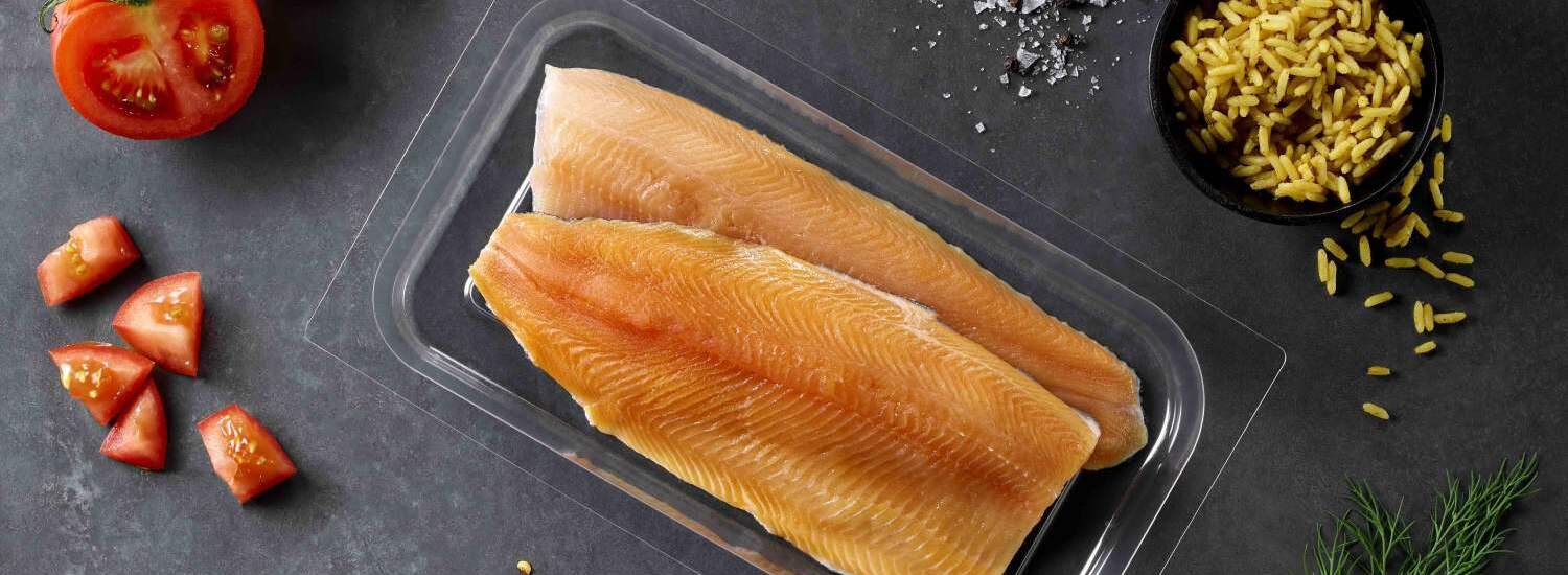 A food packaging PET rigid film with a salmon inside
