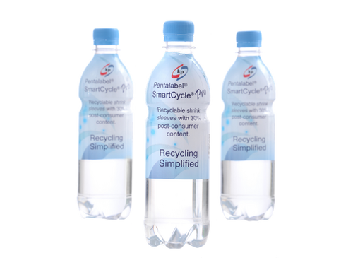 Picture showing three transparent PET water bottle with a sherink sleeve film around it