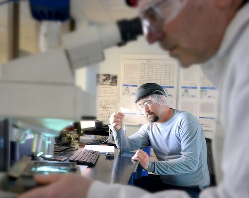 Plastic packaging research and development team conducting laboratory testing and quality analysis for innovative packaging solutions.