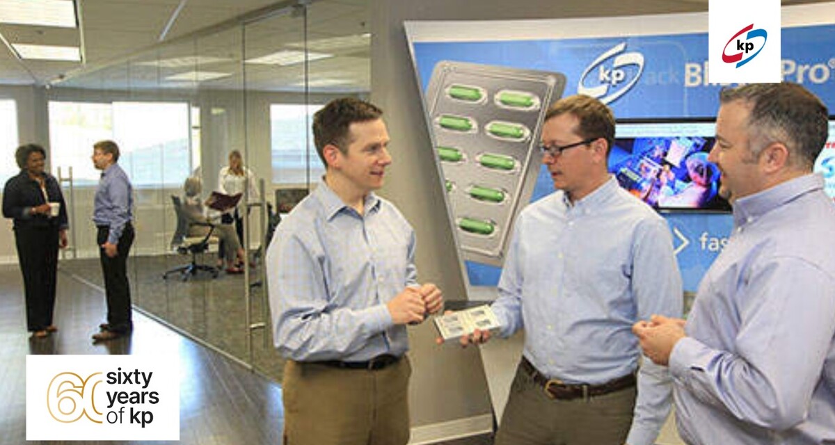 three men standing together in the kp innovation center and discussing pharmaceutical blister films