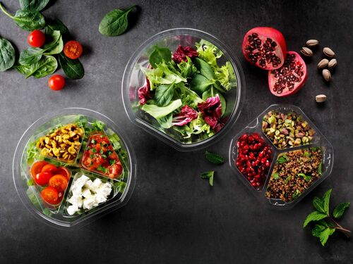 Picture showing three different transparent plastic food packaging trays rigid films with a salad included