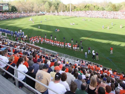 The picture shows a crowd in the Klöckner Stadium in Charlottesville watching a football game