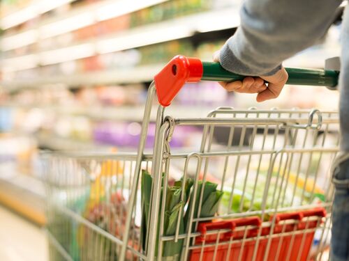 picture showing a shopping trolley in a supermarket for food packaging 
